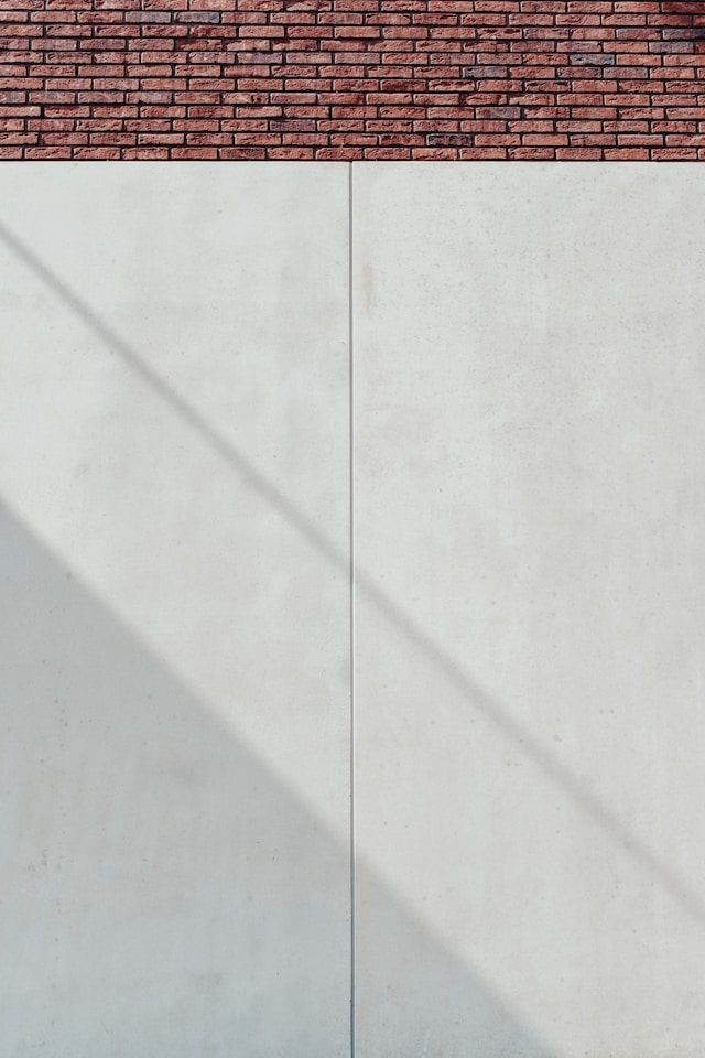Betonwand als minimalistischer Hintergrund Baustoff